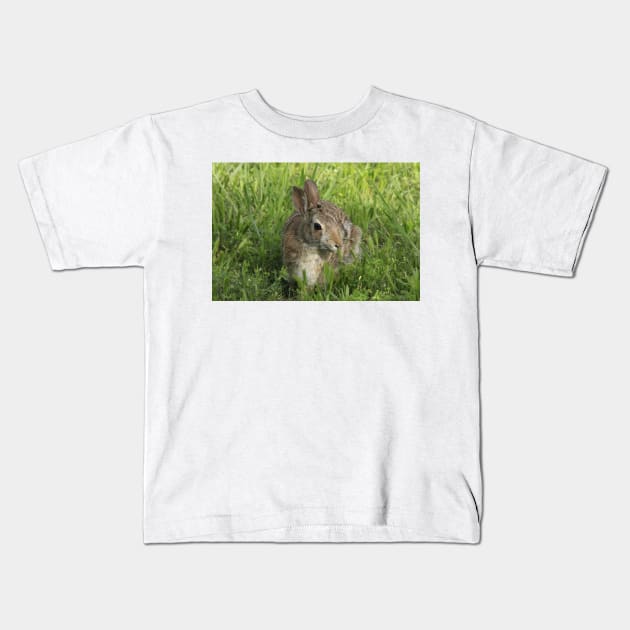 Bunny Rabbit shot closeup in the green grass Kids T-Shirt by ROBERTDBROZEK